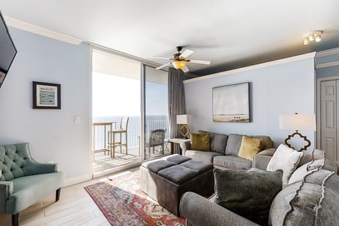 Spacious living area with comfy seating & direct beach views