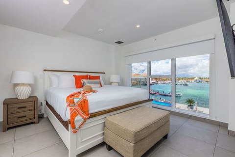Wake up to stunning marina views from your serene bedroom, where crisp linens and coastal charm create your perfect island escape.