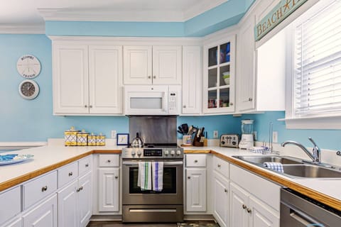 The kitchen is spacious with direct access to the 2nd floor deck with grill