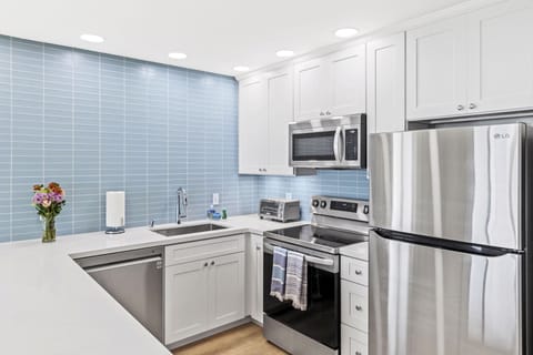 Kitchen with quartz counters and stainless steel appliances