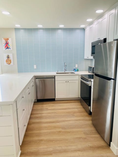 Kitchen with quartz counters and stainless steel appliances