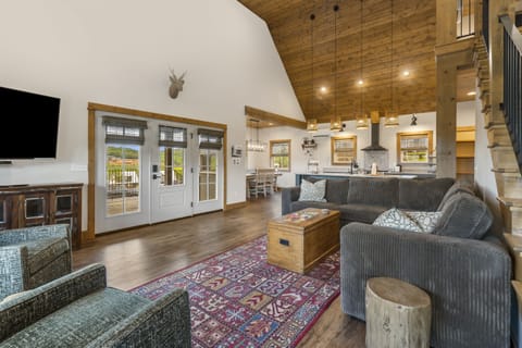 Living room area with smart tvs