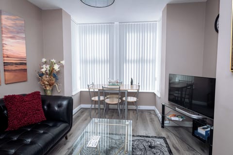 Living room with donning area. HD Smart TV  and Free wifi. Work desk in dedicate