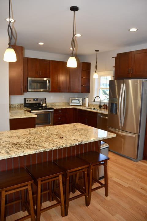 Tea kettle, coffee maker(not shown),microwave,stove,and other items are supplied