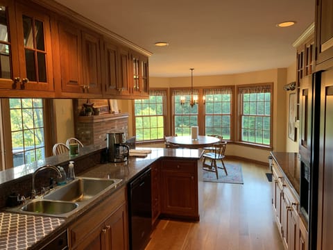 Country kitchen includes additional kitchen table with amazing views