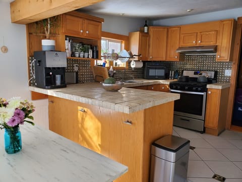 The kitchen looks out on the lake through the front room.  