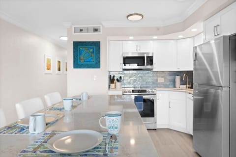 The kitchen is outfitted with all large and small appliances