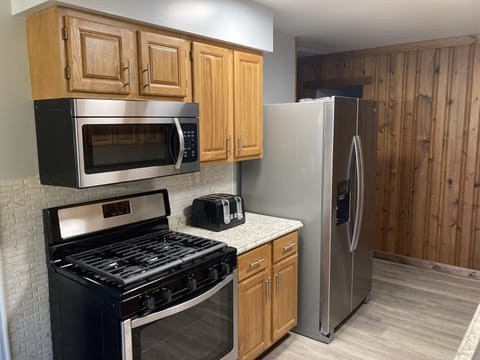 Kitchen, fully functioning with microwave, stove, fridge, dishwasher 