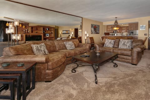 Living area with smart TV and gas fireplace.
