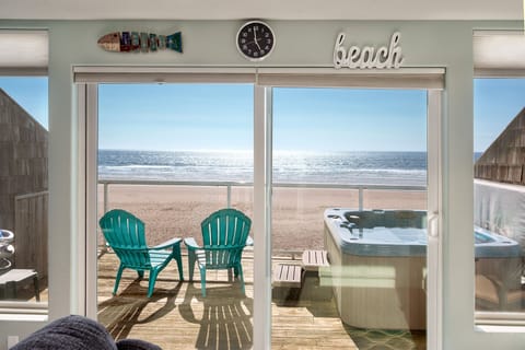Enclosed ocean-view sitting area, perfect for relaxing no matter the weather.