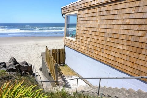 Exterior view showcasing classic coastal architecture by the beach.