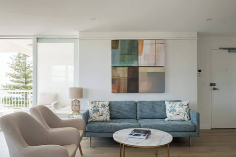 Living area with 55" Smart TV and Foxtel