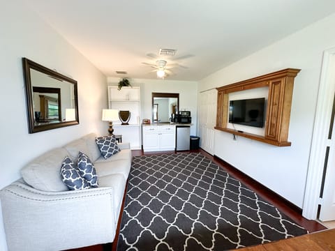 Spacious front living room with sitting area and TV