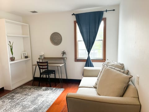 Reading sofa in front of window with garden views