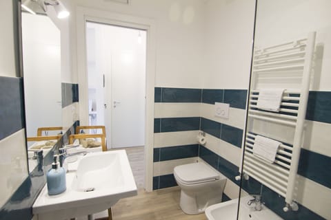 Exclusive Double Room, Accessible, Garden View (Ligea) | Bathroom | Shower, rainfall showerhead, free toiletries, hair dryer