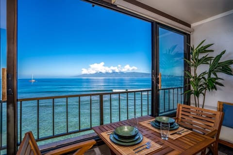 Enjoy oceanfront dining from your private balcony, where turquoise waves roll just below and tropical horizons frame every meal.