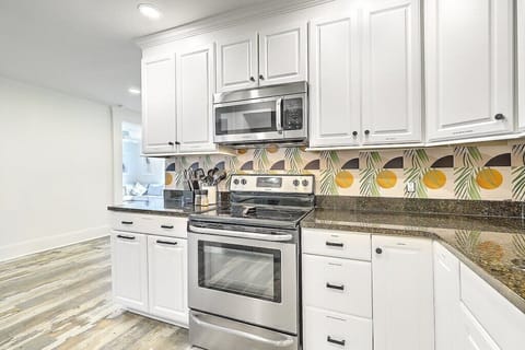 Kitchen opens to living room/dining room area