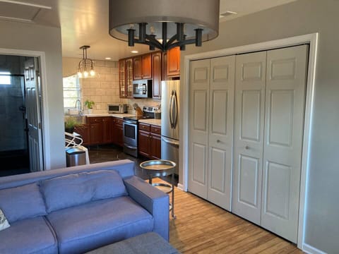 The laundry closet has a full washer and dryer