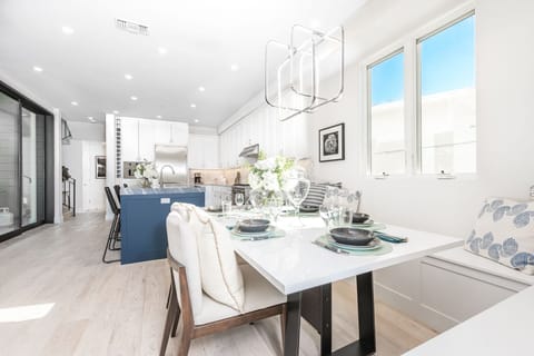 The dining area comfortably seats 5–6 guests, creating the perfect setting for elevated meals
                