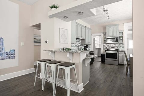 Pull up a seat at the bar and keep the chef in your group company