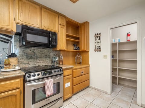 Spacious fully equipped kitchen and a pantry.