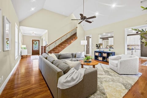 Our living room is complete with a giant sectional, oversized swivel chair, fireplace, and Smart TV.