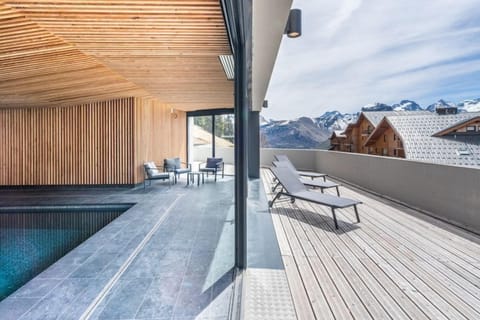Lounge in the sun by the indoor pool.