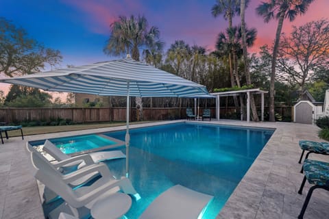 Enjoy the tanning ledge and hot tub!