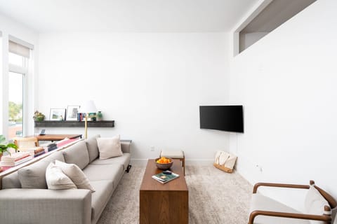 Kick back and relax in our modern living space, featuring flexible seating and a smart TV with Chromecast and Roku