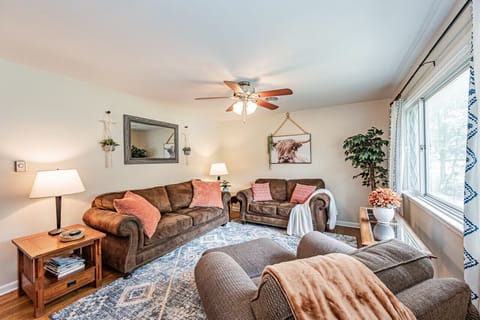 Bright & Cozy Retreat – Relax in a spacious, sunlit living room with stylish decor and ample seating for ultimate comfort.