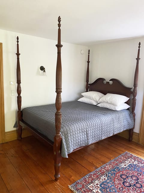 West bedroom with 4 poster queen bed