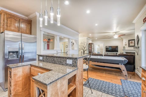 view from kitchen. new large refrigerator