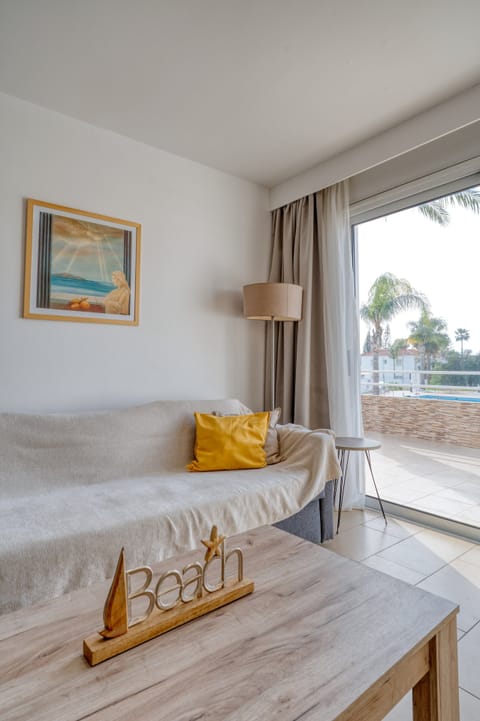 Superior Apartment, 1 Bedroom, Pool View | Living area | 43-inch Smart TV with satellite channels, TV