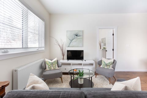 Clean, simple, and modern living room space to enjoy the Roku tv and relax