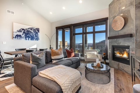 Living Room with sleeper sofa, 55" Samsung smart TV and cozy gas fireplace.