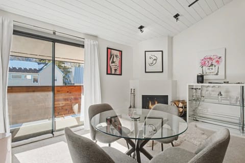 A dining table for 4, wood burning fireplace, working desk space and contemporary bar are amenities found in this rental.