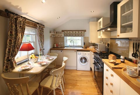 Ground floor:  Kitchen with range cooker and small breakfast table