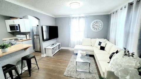 Open space concept with breakfast bar. Living room has a 65" smart flat screen TV.  