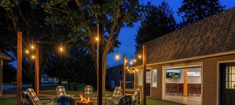Where cozy farmhouse charm meets unforgettable Door County nights. Gather around the fire, unwind under the café lights, and make memories that last long after vacation ends.
