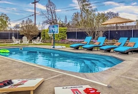 The outdoor oasis has a heated pool, fire pit, yard games and plenty of seating!