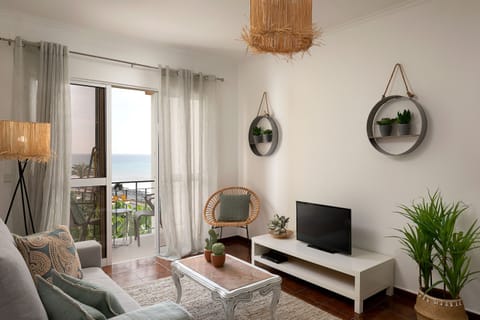 Intimate living room with balcony, perfect for a family or a group of friends