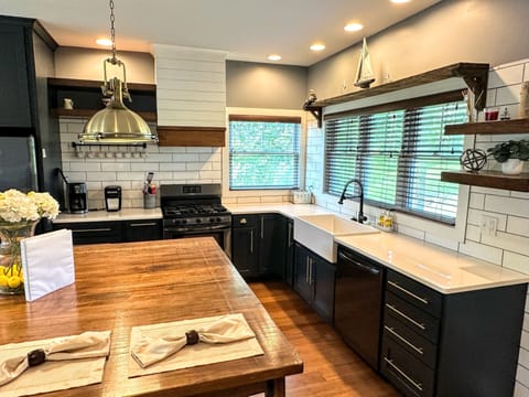 Farm sink and dishwasher make for efficient prep and clean up.