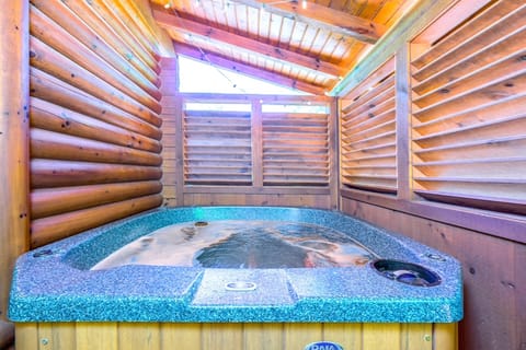 Secluded hot tub retreat with warm wooden privacy walls