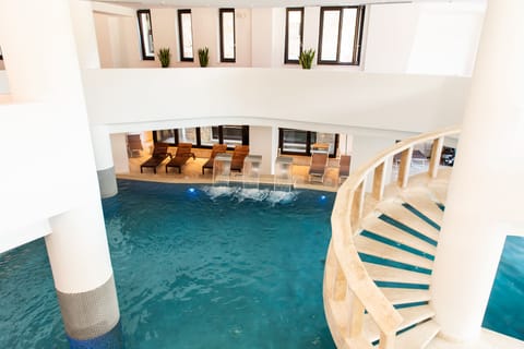 Indoor pool, seasonal outdoor pool, pool umbrellas, sun loungers