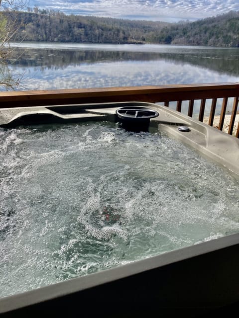 Enjoy your private hot tub surrounded by the lake and trees!