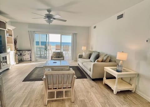 Relax in your bright living room with ocean views through sliding doors to your private balcony.