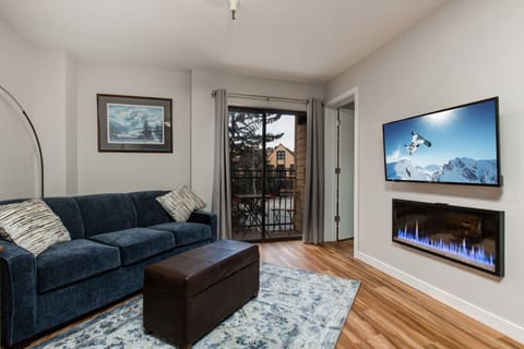 Vacation Rentals in Park City at Carriage House 320: Living room with sleeper sofa, fireplace, HD TV, and patio access