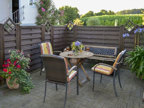 Flower, Plant, Furniture, Property, Flowerpot, Table, Chair, Outdoor Table, Outdoor Furniture, Wood