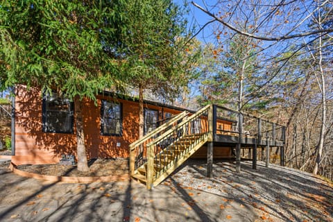 Retreat's hilltop trees enjoyable from our new extra wide 3/4 wrap deck 