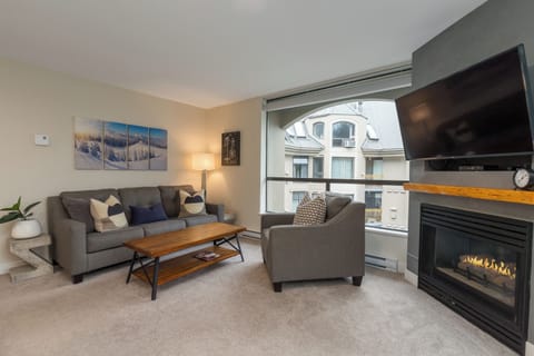 Open living space with a cosy gas fireplace. The perfect retreat after a big day exploring the mountains.